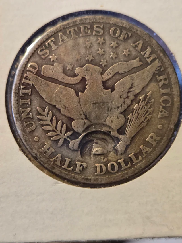 1915 Barber half dollar broadstrike error compared to normal example showing expanded diameter and missing reeding